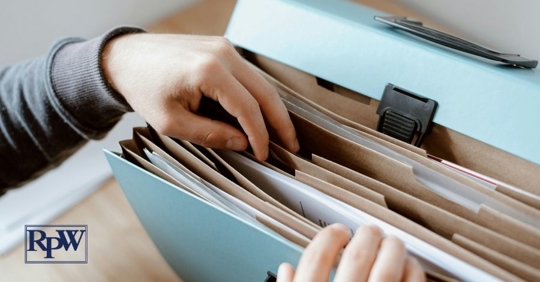 person searching evidence files